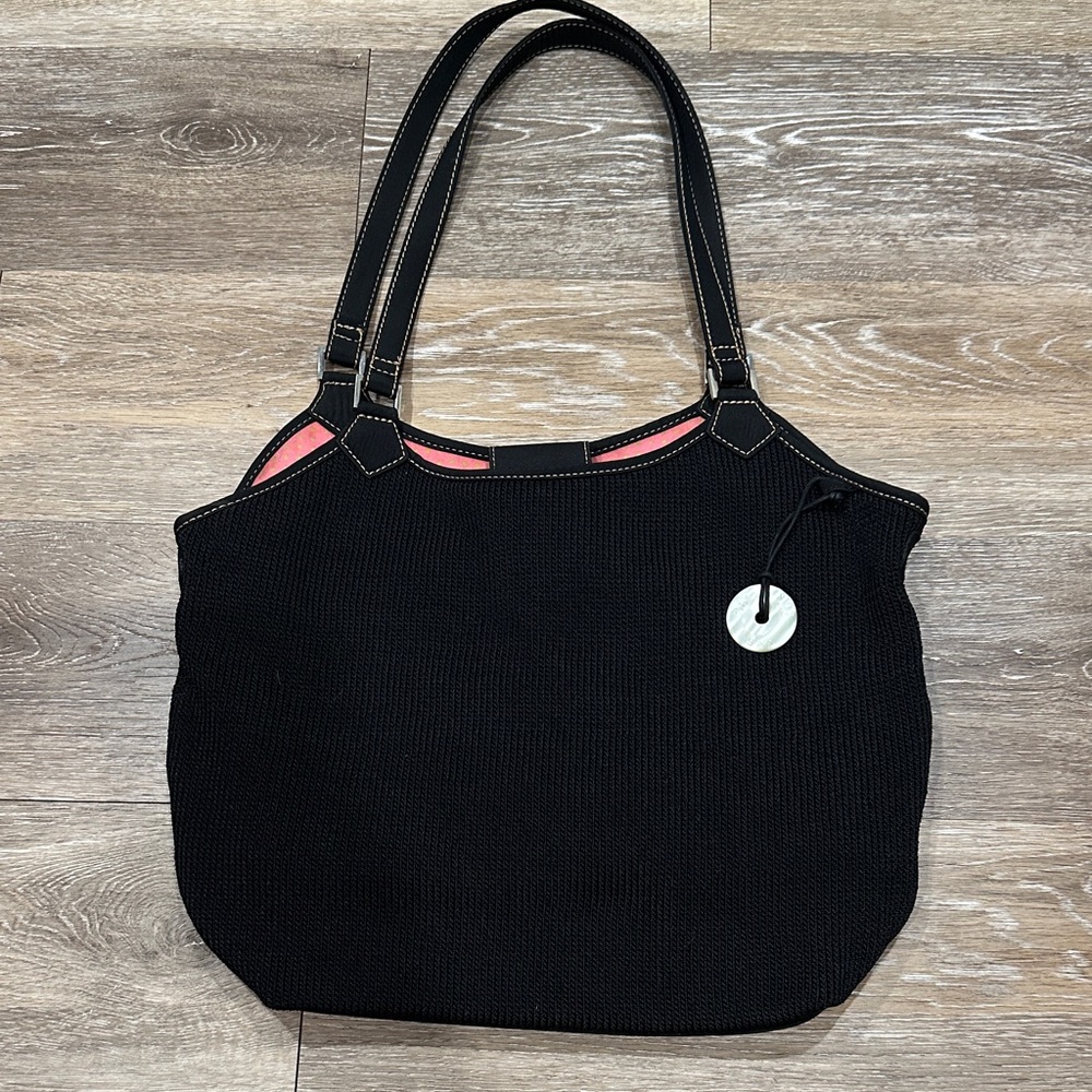 The SAK Chic Black Tote Bag with Pink and Lime Green Polka Dot Interior